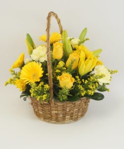 Bright yellow flowers in beautiful basket