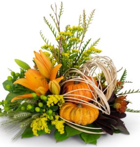 fall flower arrangement with small pumpkins